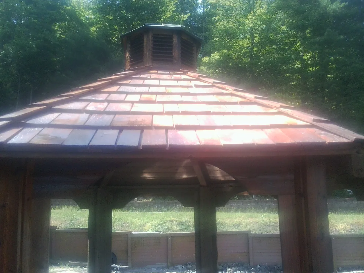 New cedar shake roof and cupola on a lakeside gazebo in Pleasant Valley